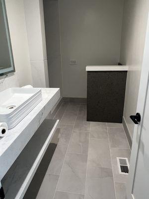 floating vanity with natural stone.