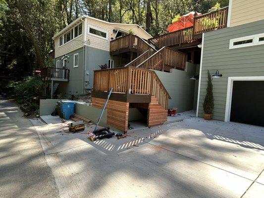 Outdoor second floor stairs.