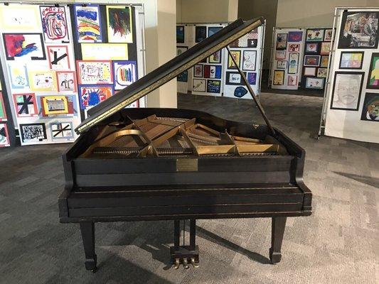 Historical baby grand piano at the American Jazz museum