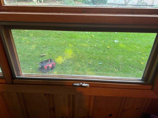 A new window pane in a tilt-out den window.