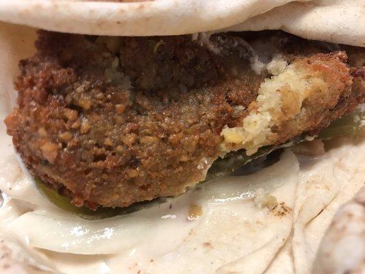 Falafel sandwich in pita bread. Very good with added hot sauce.