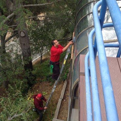 Cleaning a solarium glass roof can be dangerous but as long as you have a man on the ladder is safe.