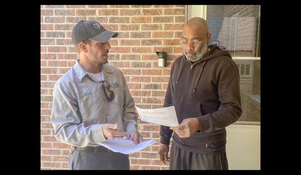 Technician Matt discussing the repairs needing to be done to the home. We provide detailed inspection reports on most services