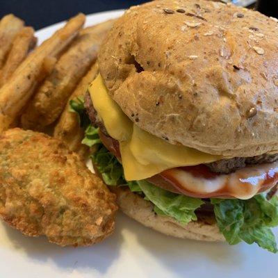 American Classic Burger with multigrain buns, potato wedges and jalapeño pops.