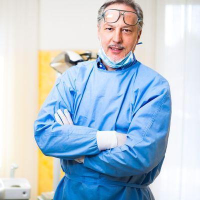 Patient recovering comfortably after oral surgery with an ice pack applied.