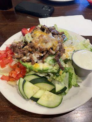 Stuffed avocado with carne asada and blue cheese dressing.