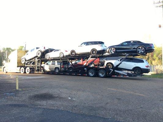 Examples of a 7 car carrier used for out of states car transportation.