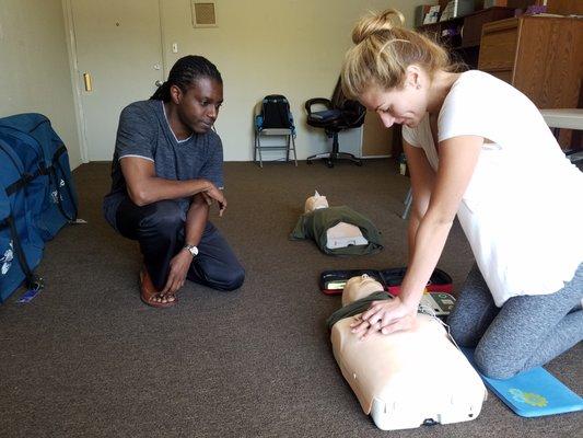 Kobby instructing Adult CPR with AED