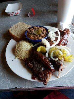 Brisket and sausage with beans and potato salad. Delicious!