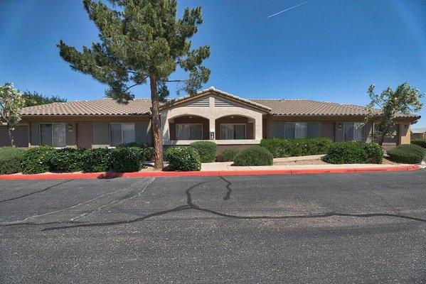 a house with a red curb in front of it at Desert Sage