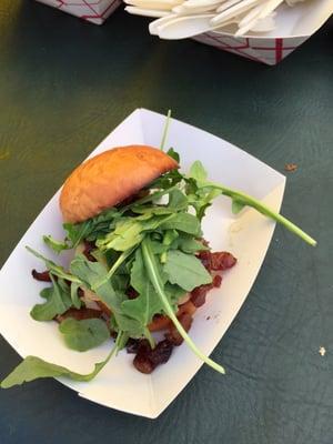 Coho salmon slider with apple aioli, bacon and market greens