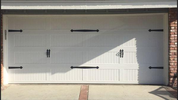 16 x 7 fully insulated steel back with Carriage stamp panels and decorative Hardware. LiftMaster jackshaft for garage door opener