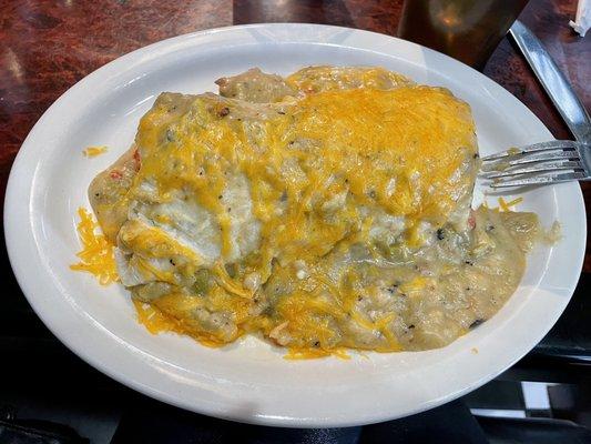 Breakfast burrito with green chili sauce