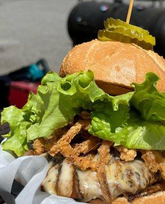 Mushroom Swiss Burger- marinated strips of portobello and crispy fried onions adorn our signature patty with swiss cheese - fully dressed!