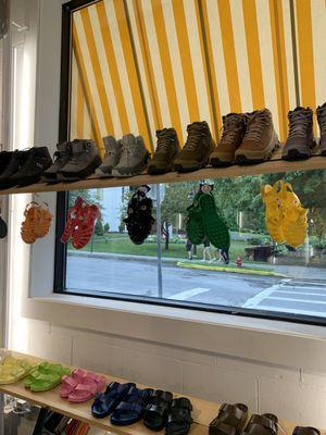 Colorful summer sandals in window