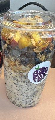 Vanilla overnight oats with granola blueberries and peaches