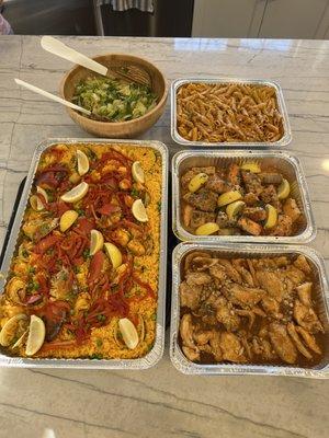 Seafood paella, chicken with garlic sauce, salmon, penne with Vodka sauce