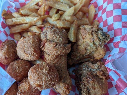 1 thigh, 2 legs, hush puppies, and fries.