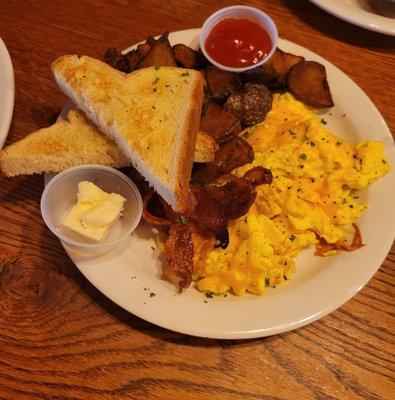 Eggs, bacon, toast, and home fries