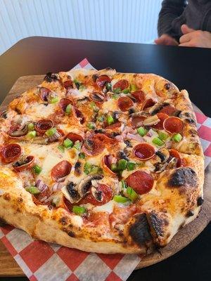 Medium Pizza with pepperoni, mushrooms, green pepper and onions.  Absolutely the best wood oven pizza around.