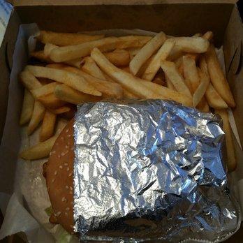 Nice sized burger wrapped in foil with fries