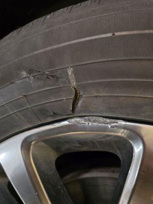 Broken rim, damaged tire