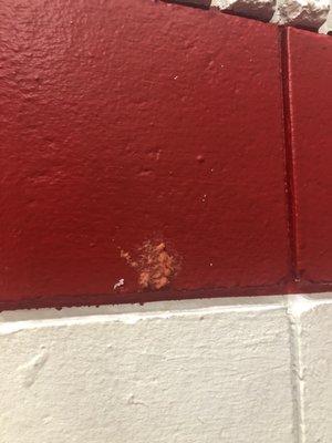 Gum on the gym wall where kids play... hope they actually cleaned this off before their recent painting