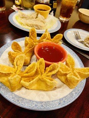 6 Pieces Fried Crab Meat Rangoon with 8 Pieces Pork Dumpling in the back - plus or minus some dumplings