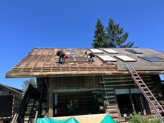 Removing very old skylights in a concrete roof removal project. This team took special effort to control cleanliness INSIDE our home.