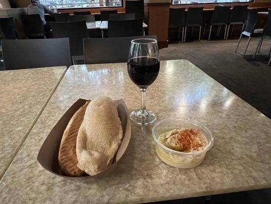 Warm pita with humus and a glass of wine - nice way to relax on the town square.