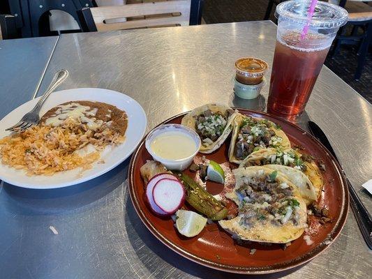 Combo 1 with all steak tacos, rice, and refried beans