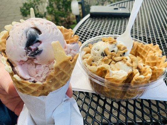 Cherry vanilla in waffle cone, and cookie and cream in waffle bowl with cashews