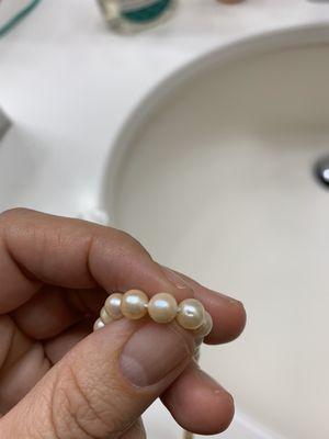 Damaged pearls, and a completely different necklace than what we turned in for repair.