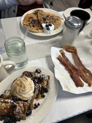 Blueberry French toast, blueberry chocolate chip pancakes, bacon