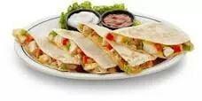 Our signature chicken quisadilla Also available n beef and steak Serve with sour cream and salsa