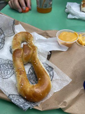 Pretzel with nacho cheese.