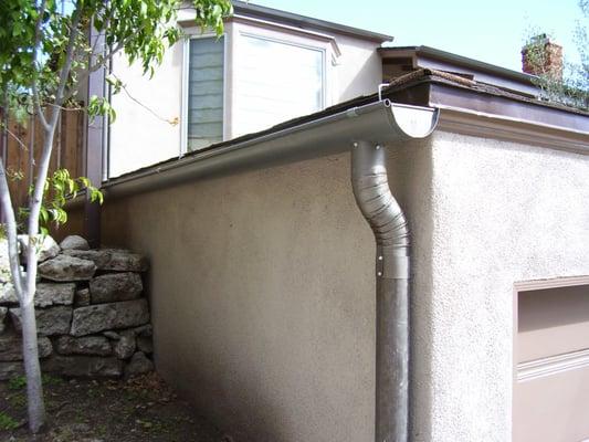 Stainless steel rain gutter and downspout