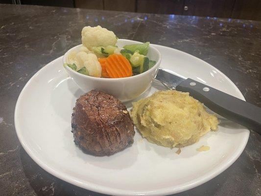 Filet, potatoes, and veggies.