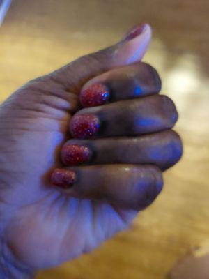 The nail powder didn't  dry right not shiny. I put oil on my hands for Pic. I complained 3x at salon