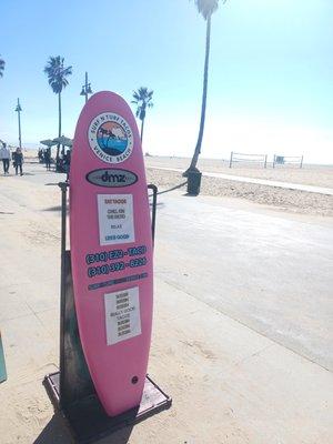 Look for our iconic pink surf boards!