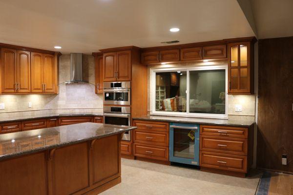 New remodeled kitchen with new cabinets, flooring, appliances and kitchen island.