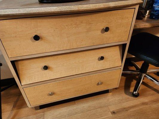 Face of dresser drawer falling off.