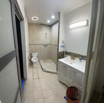 Turned a closet and small bathroom into a master bathroom with tucked sliding doors