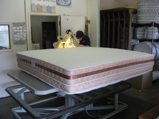 Sewing a mattress in the factory