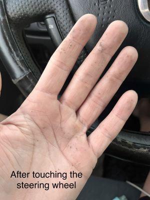 dirty hand covered in oil from my steering wheel