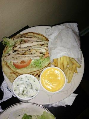 Chicken pita with fries and  a cup of cheese.  Delicious