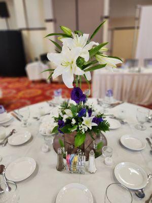 Casablanca lilies and purple lisianthus in wood box