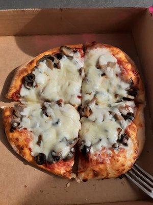 Personal size mushroom and black olive pizza. You can get a personal 7" pizza at lunchtime.