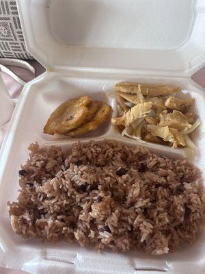 Conch with chopped Onions and a side of Rice and beans also fried plantains.