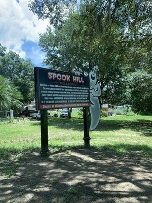 Spook Hill informational sign with a friendly ghost